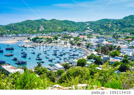 View on Vietnamese fishing village with many boats on the water View on Vietnamese fishing village with many boats on the water 109113410