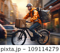 Side view of young man in helmet with backpack and courier riding bicycle on city street near buildings at sunset 109114279
