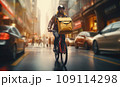Focused young male delivery man in protective helmet riding bicycle with cardboard boxes on street in city 109114298