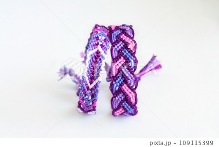 DIY woven friendship bracelets with different braiding. Summer accessory DIY woven friendship bracelets with different braiding. Summer accessory 109115399