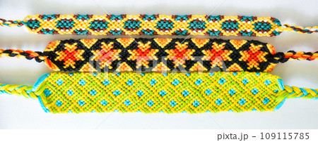 DIY woven friendship bracelets with different braiding. Summer accessory DIY woven friendship bracelets with different braiding. Summer accessory 109115785