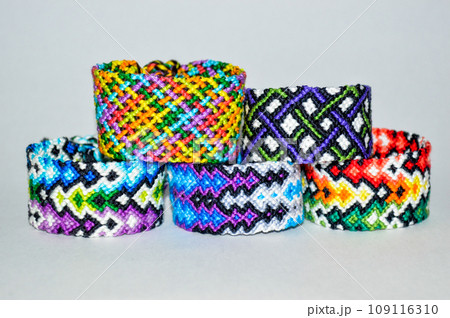 DIY woven friendship bracelets with different braiding. Summer accessory 109116310