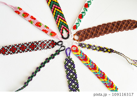 DIY woven friendship bracelets with different braiding. Summer accessory DIY woven friendship bracelets with different braiding. Summer accessory 109116317