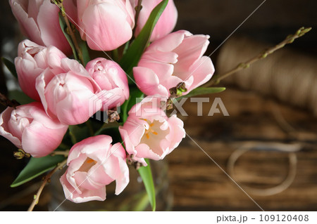 Beautiful bouquet with spring pink tulips on table, above view Beautiful bouquet with spring pink tulips on table, above view 109120408