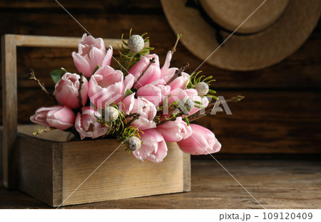 Beautiful bouquet of spring pink tulips on wooden table Beautiful bouquet of spring pink tulips on wooden table 109120409