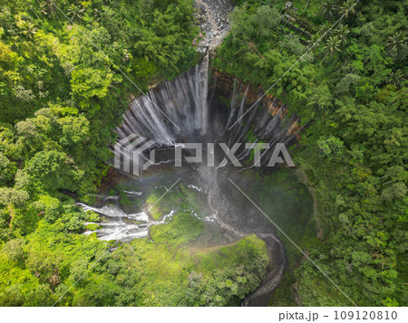 Rainbow at Tumpak Sewu Waterfall. East Java. Indonesia. Stunning aerial view Rainbow at Tumpak Sewu Waterfall. East Java. Indonesia. Stunning aerial view 109120810