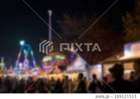 Blurred image bokeh of People walking, shopping at Winter Wonderland, a Christmas Market in Hyde Park, London. 109121513
