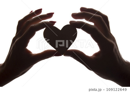 Symbol heart and love in female and male hands - silhouette 109122649
