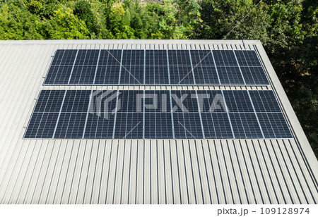 Photovoltaic solar energy panels on house roof. 109128974