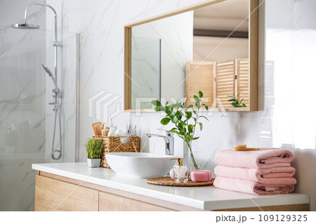 Large mirror over vessel sink in modern bathroom 109129325