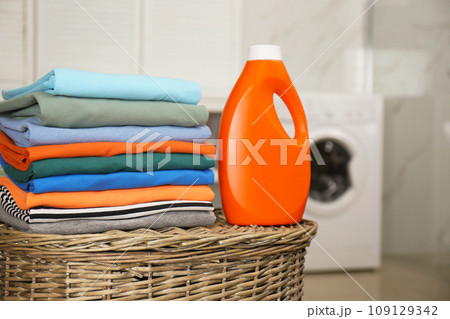 Fresh laundry and detergent on basket in bathroom 109129342