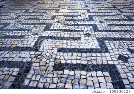 Geometric Pattern in Traditional Mosaic Paving Tiles in Braga, Portugal. 109136128