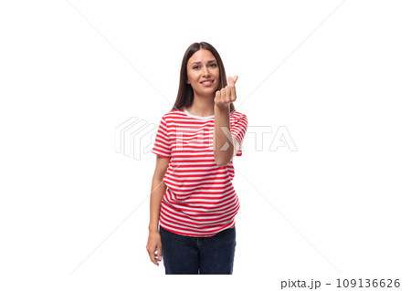 young satisfied cheerful brunette woman in a red-white striped t-shirt on a white background with young satisfied cheerful brunette woman in a red-white striped t-shirt on a white background with 109136626