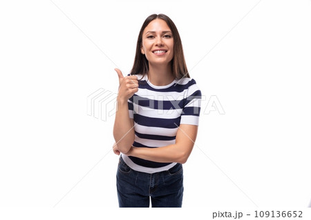 young lucky happy brunette woman with straight hair dressed in a striped t-shirt 109136652
