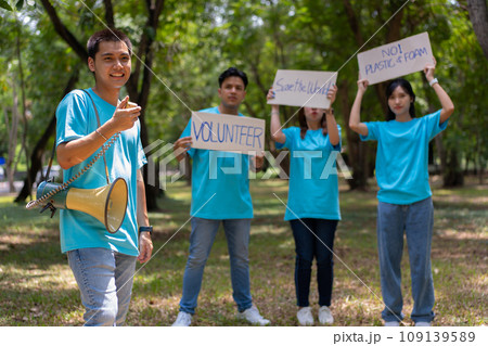 Happy young Asian students diverse volunteers hold a campaign sign for cleaning in the park, The concept of environmental conservation on world environment day, recycling, charity for sustainability. Happy young Asian students diverse volunteers hold a campaign sign for cleaning in the park, The concept of environmental conservation on world environment day, recycling, charity for sustainability. 109139589