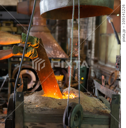 Ferrous metal billet is melted in an induction furnace closeup Ferrous metal billet is melted in an induction furnace closeup 109141226