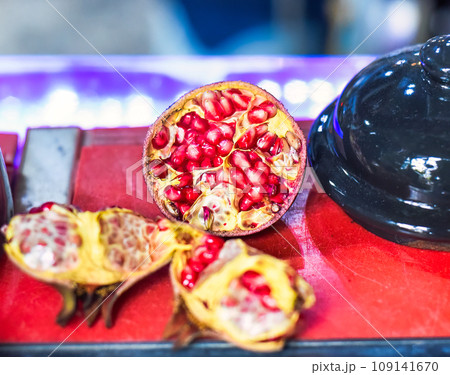 Ripe peeled Pomegranate fruit on a table Ripe peeled Pomegranate fruit on a table 109141670