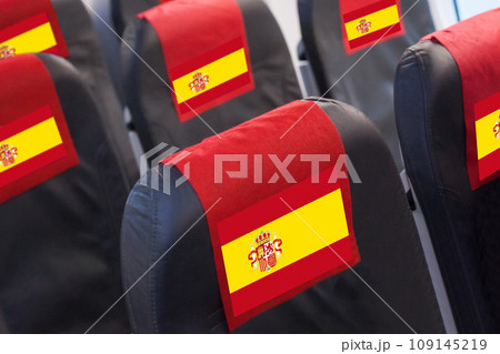 Empty seat in plane with Spanish Flag. Travel, flight and transportration in Spain concept 109145219