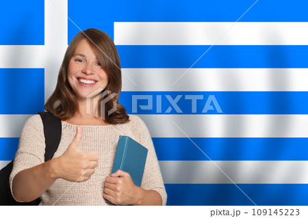 Happy woman student against Greek flag background. Travel, education and learn language 109145223