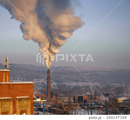 Plume of thick smoke from the pipe of an industrial heat station in the frosty Siberian air. Plume of thick smoke from the pipe of an industrial heat station in the frosty Siberian air. 109147189