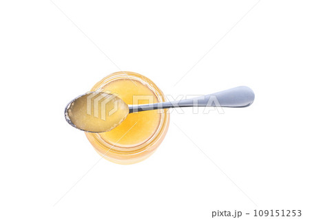 Top view of ginger jam in jar with spoon isolated on white background. Top view of ginger jam in jar with spoon isolated on white background. 109151253