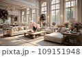 Interior of classical living room in luxurious villa. Comfortable cushioned furniture, coffee table, lots of flower bouquets in vases, gorgeous chandelier, large windows with picturesque view. 109151948