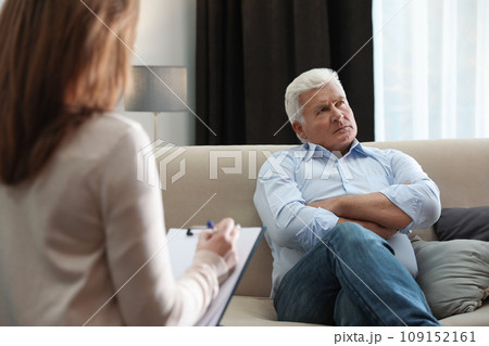 Professional psychotherapist working with patient in office Professional psychotherapist working with patient in office 109152161