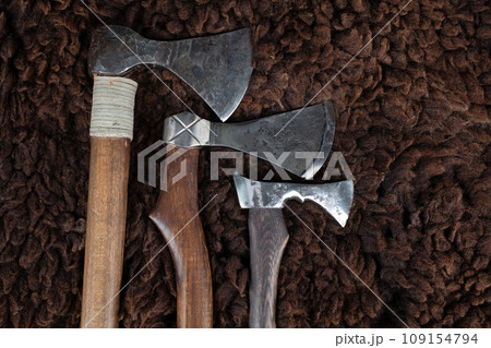 Vintage axes on sheep fur Vintage axes on sheep fur 109154794