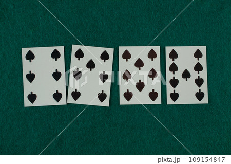 Old west era playing card on gambling table. 6, 7, 8, 9 of spades. 109154847