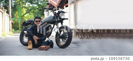 Banner Asian man motorbike in black leather jacket travel rider trip. Panorama Handsome Men wear sunglass outdoor lifestyle freedom rider. Hipster asian man hobby ride motor bike with copy space Banner Asian man motorbike in black leather jacket travel rider trip. Panorama Handsome Men wear sunglass outdoor lifestyle freedom rider. Hipster asian man hobby ride motor bike with copy space 109156730