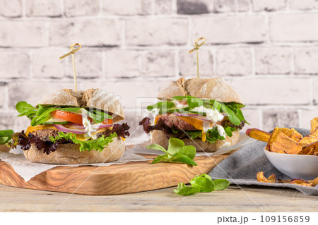 Healthy vegan burger with fresh vegetables and yogurt sauce Healthy vegan burger with fresh vegetables and yogurt sauce 109156859