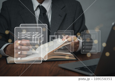 business management with document check list at work place. Man holding pen mark on checklist report virtual screen. business management with document check list at work place. Man holding pen mark on checklist report virtual screen. 109158351