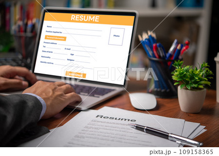 Man writing resume and CV Applicant searching for new work and typing computer laptop. Job search and unemployment. Man writing resume and CV Applicant searching for new work and typing computer laptop. Job search and unemployment. 109158365