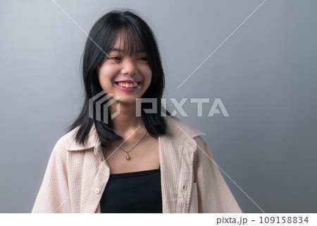 Happy Asian Teen Girl in Closeup Portrait on background. 109158834
