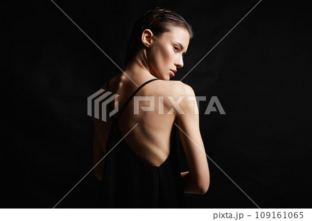 young woman with wet Hair. Beautiful sexy model Girl in black Dress young woman with wet Hair. Beautiful sexy model Girl in black Dress 109161065