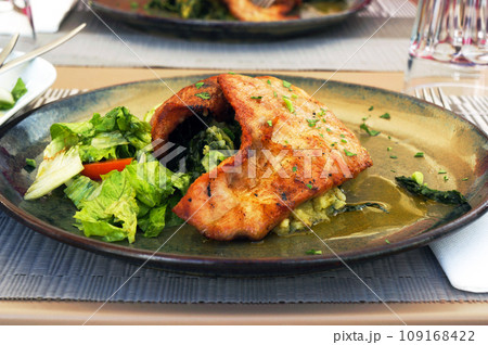 Roasted Pork made from Meat of a Black Piglet with Fresh Vegetables in Guimaraes, Portugal. 109168422