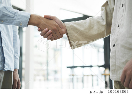 Businessmans handshake after good deal. 109168862