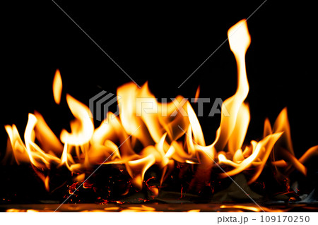 Fire Flames Blaze burn on black background isolated. Firing flaming on paper abstract texture. Fire burn on paper to ashes and create flame. Photo real high resolution Fire Flames Blaze burn on black background isolated. Firing flaming on paper abstract texture. Fire burn on paper to ashes and create flame. Photo real high resolution 109170250
