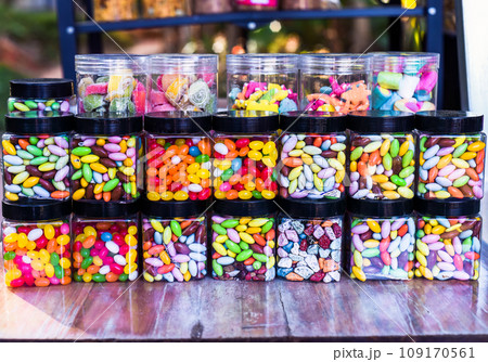 Many colorful candy and lollipops with gum in jars 109170561