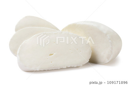 Mozzarella cheese cut into pieces on a white background. Isolated Mozzarella cheese cut into pieces on a white background. Isolated 109171896