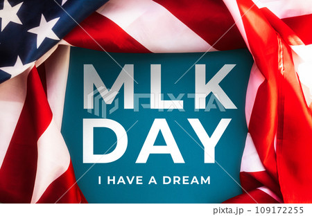 Blue background framed with American Flag and text abbreviation MLK. Happy Martin Luther King Day concept Blue background framed with American Flag and text abbreviation MLK. Happy Martin Luther King Day concept 109172255