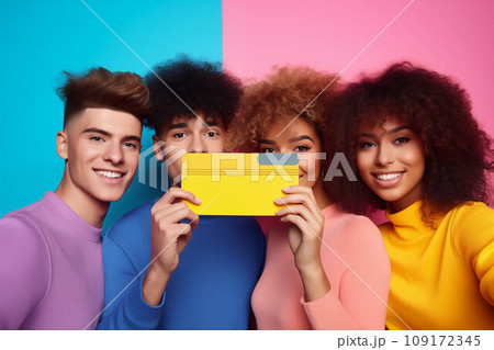 Diverse group of teenagers hold huge credit card Diverse group of teenagers hold huge credit card 109172345