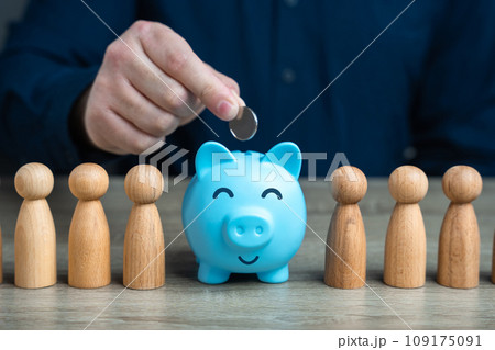 A man puts a coin in a piggy bank among people. Political purses wallets and concealment of financial fortunes through third parties. Collection of donations. Accumulating money. Savings 109175091