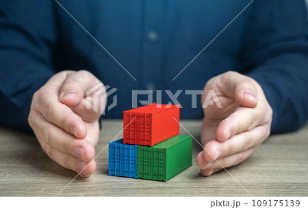 Man protects shipping containers with his hands. Security, reliability, and protection of the global supply chain. Safe transit of goods against potential threats and risks. Prevent compromise 109175139