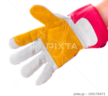 gloved hand with hacksaw 109176971