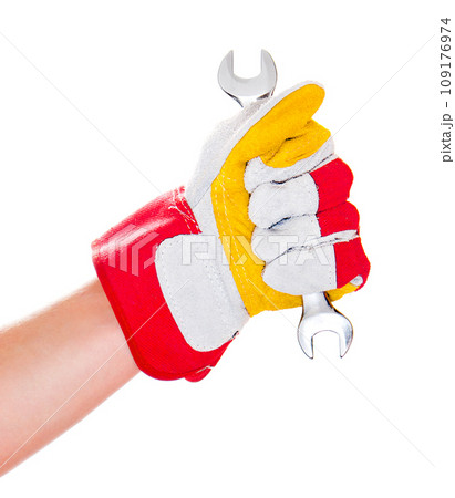 gloved hand with wrench 109176974