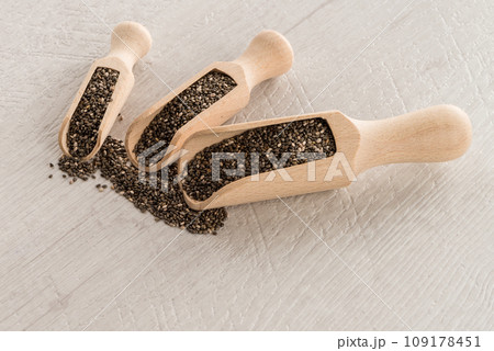 Chia seeds in wooden scoops 109178451