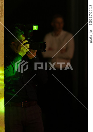 A photographer at work, the process of shooting and photographing celebrations. Paparazzi conducts a journalistic investigation at a party. 109179318