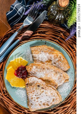 Pancakes stuffed with cheese . 109179914