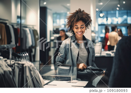 African American woman Customer Shopping in Modern Clothing Store And Choosing Stylish Clothes 109180093